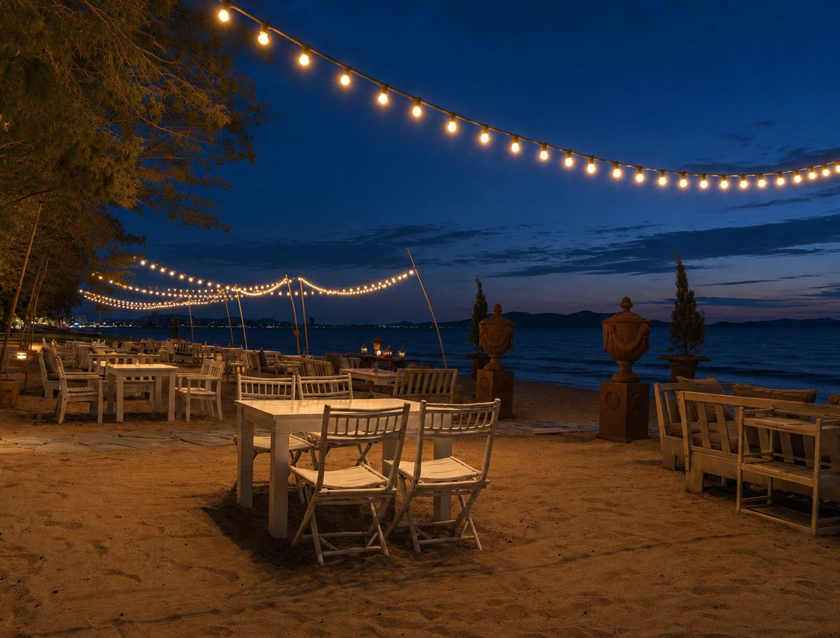 Thailand beach restaurant sand tables lights evening