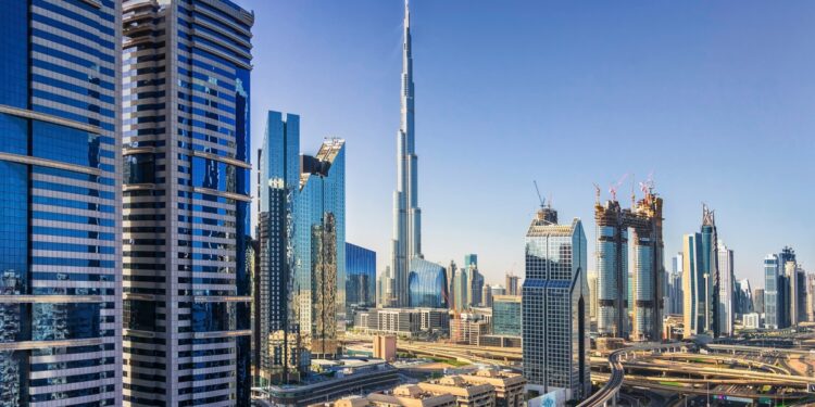 Sunny cityscape of Dubai under a blue sky